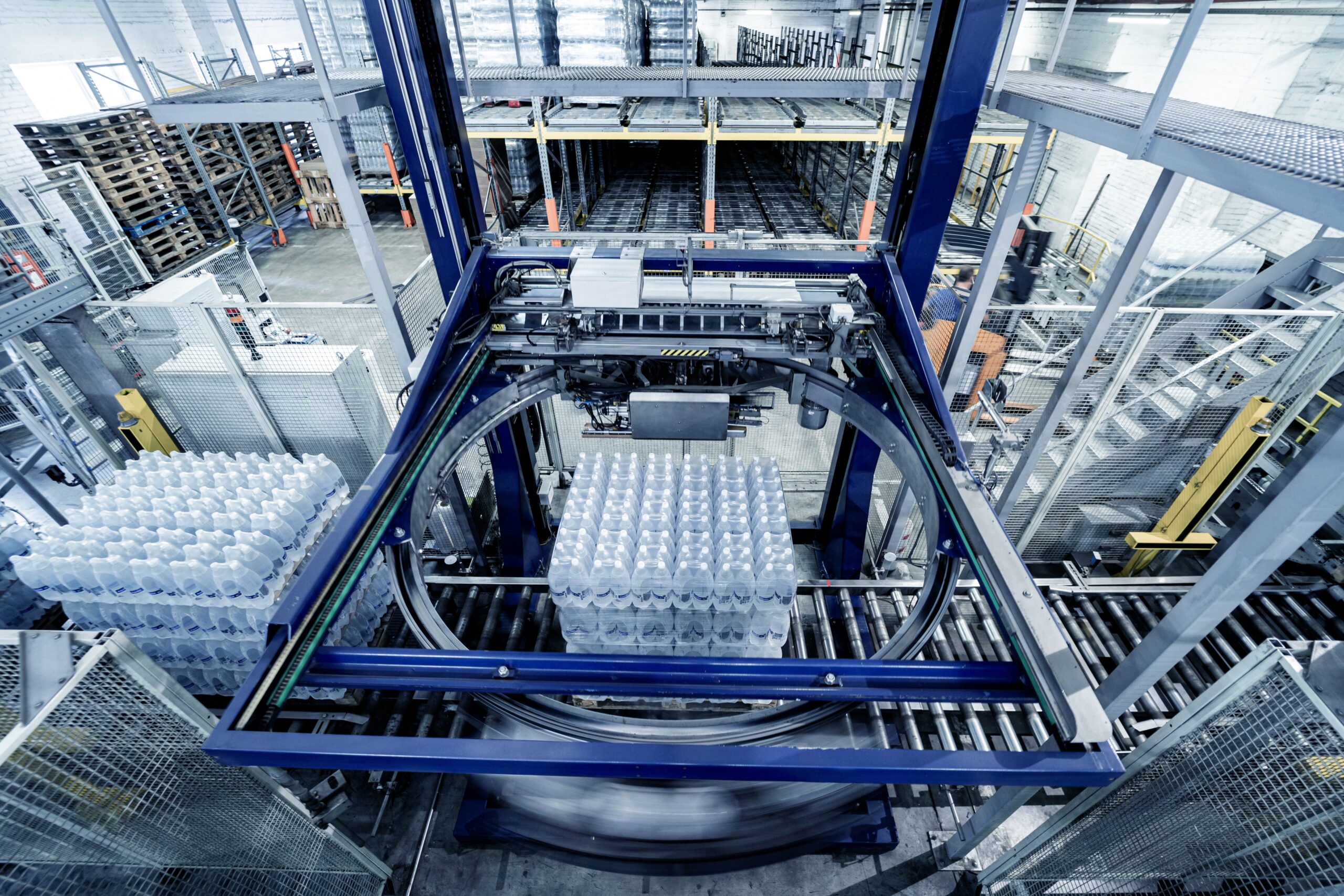 Modern,Strapping,And,Transporting,Machine,For,Packaging,Line,At,Beverage